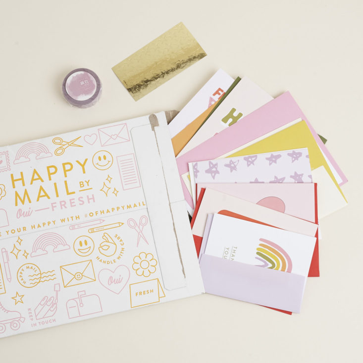 Happy Mail by Oui Fresh envelope with items spilling out