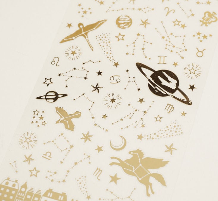 close up of gold foil constellation stickers