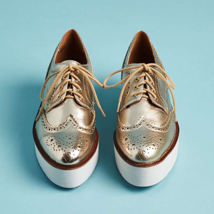 gold brogue shoes from the front