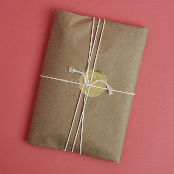 package wrapped in kraft paper and twine