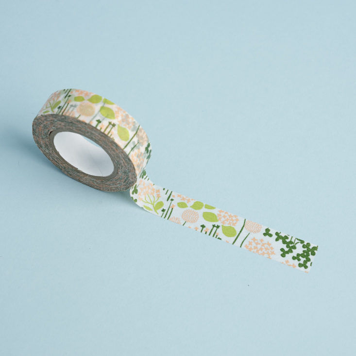 un rolled Classicky Little Garden Washi Tape
