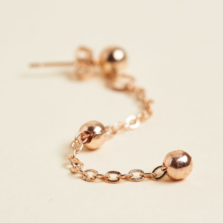 close up of rose gold minimal earring