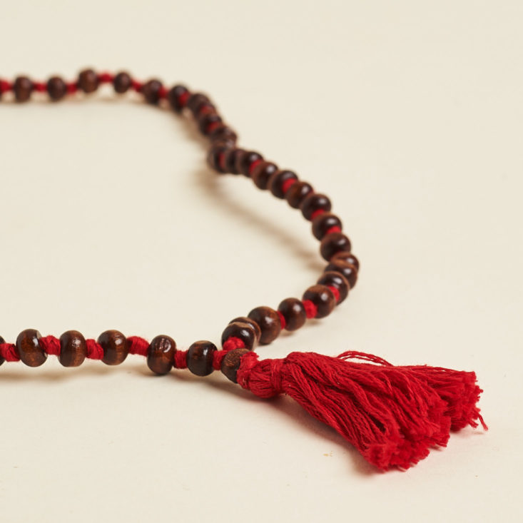 globe in mindfulness mala tassel