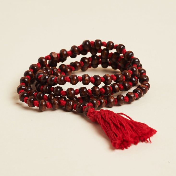 globe in mindfulness mala in a coil
