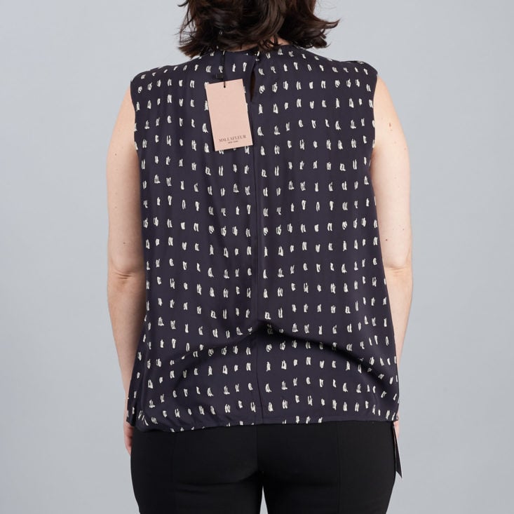 mm lafleur back of navy top