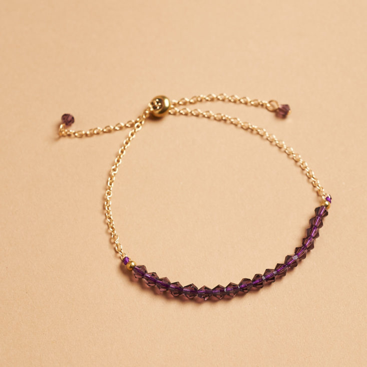 purple crystals on bracelet