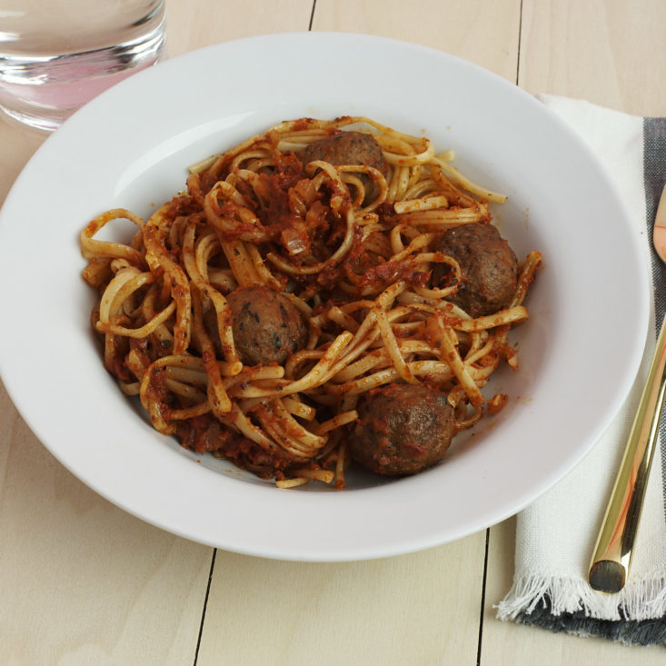 close up of plated Classic Italian Meatballs with Classic Tomato Sauce and Linguine