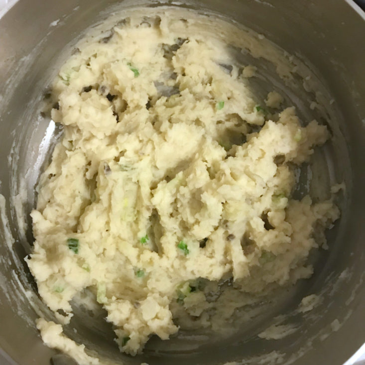 mashed potatoes with green onion, parmesan cheese and evaporated milk added