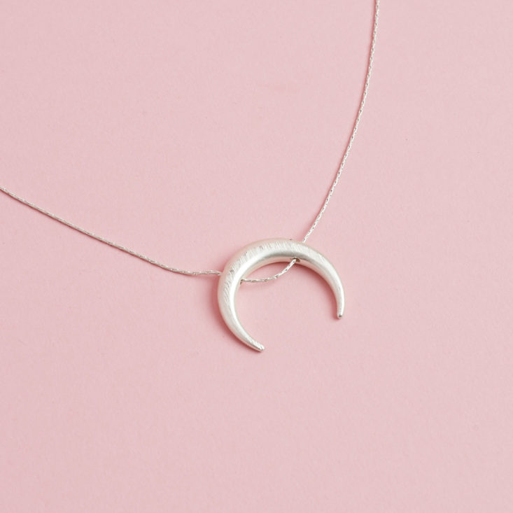 close up of White Gold Dipped Crescent Moon Necklace