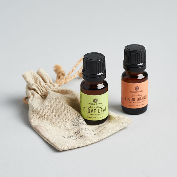 Blood Orange and Clove Leaf essential oils on top of pouch