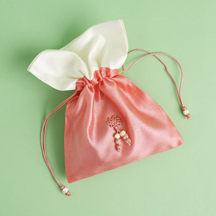 Pinka nd white cloth snack pouch