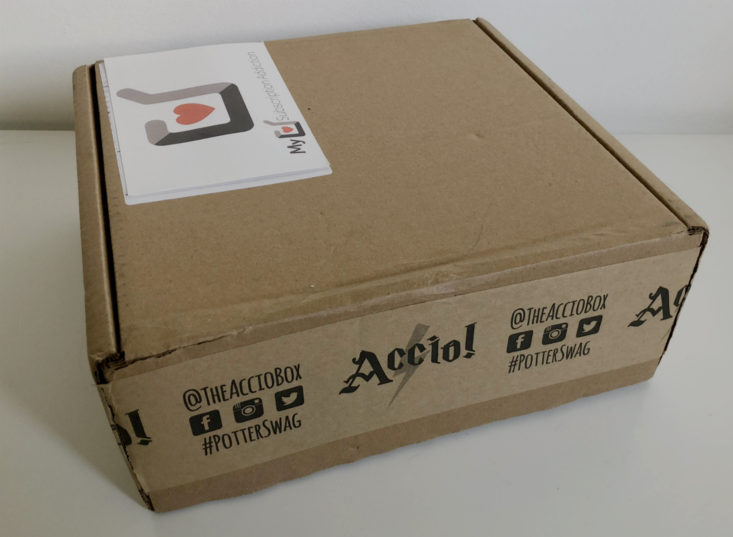 closed cardboard box with Accio printed on the side