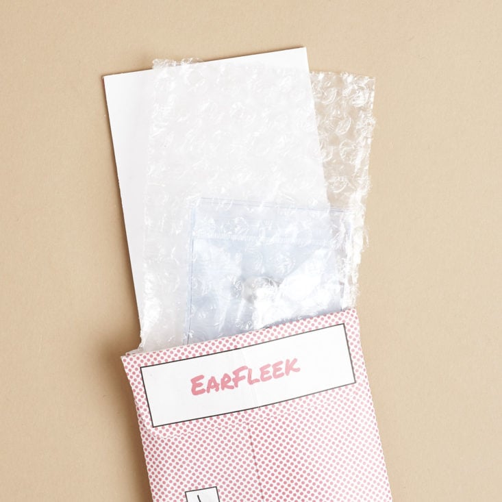 EarFleek envelope with items coming out