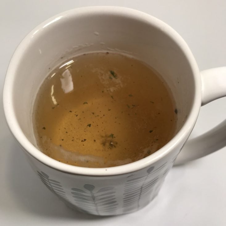 candlelit tea in mug