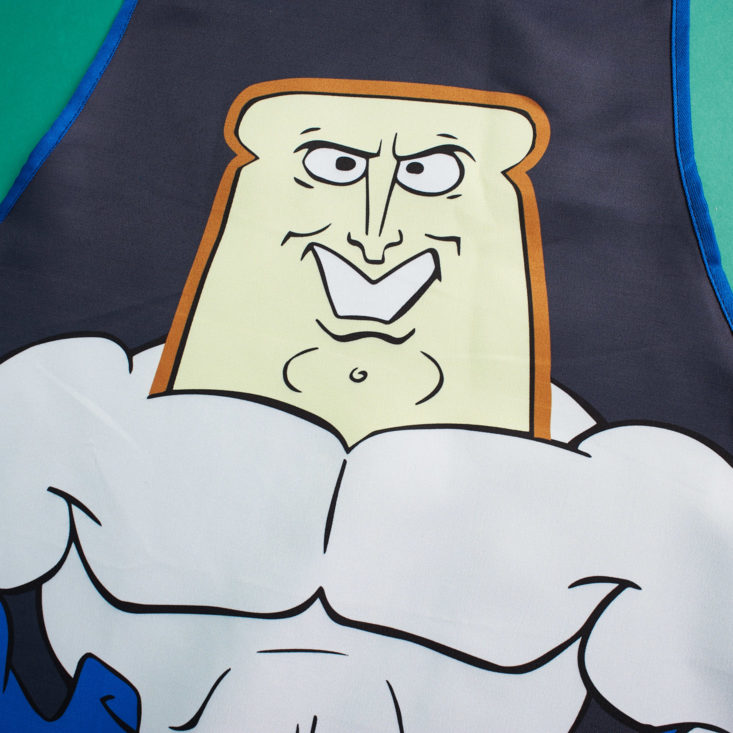 The Nick Box by Culturefly December 2018 - Powdered Toastman Kitchen Apron Closeup Top