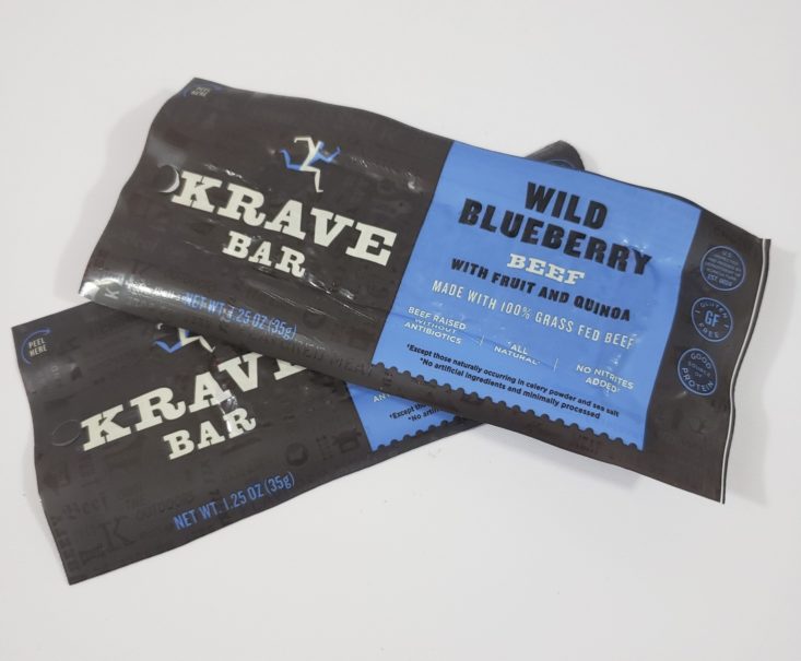 MONTHLY BOX OF FOOD AND SNACK February 2019 - Krave Bar Wild Blueberry Beef with Fruit and Quinoa Bar Front Top
