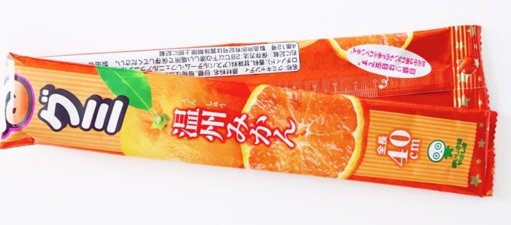 Japan Candy Box Sakura Surprise Review April 2019 - Long Sakeru Peeling Gummy in Mandarin Orange Package Top