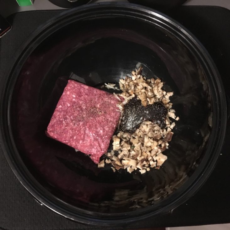 ground beef and mushrooms in a mixing bowl