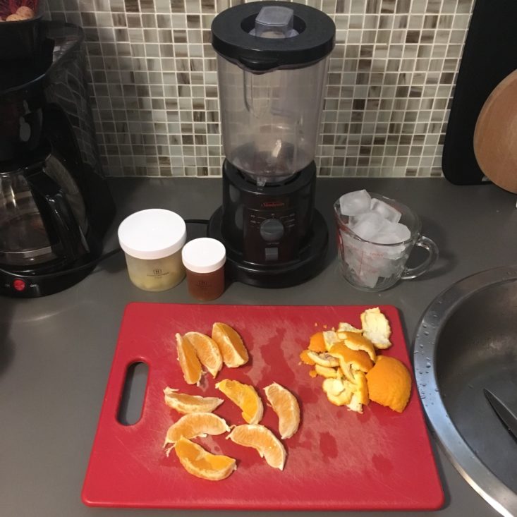 pineapple passion smoothie ingredients laid out in front of the blender