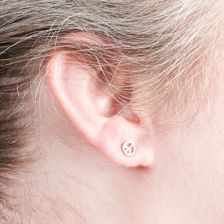 earrings in megans earlobe