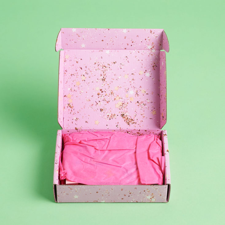 open box with pink tissue
