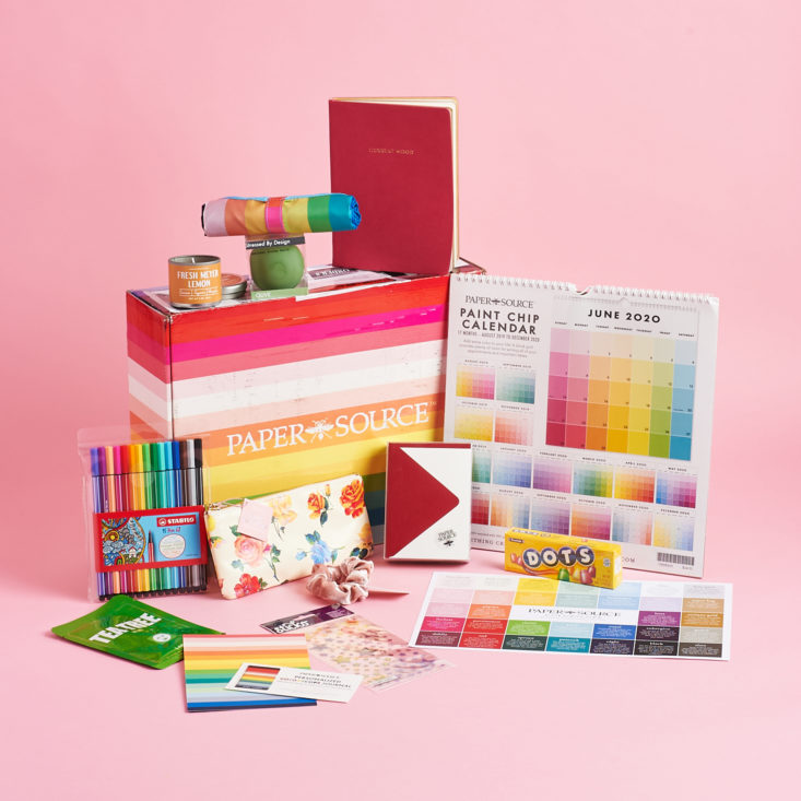 Group of all 12 items around rainbow Paper Source box