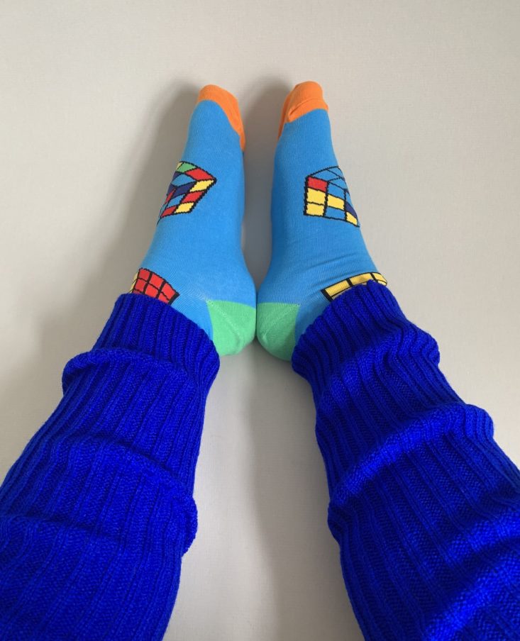 rubik's cube socks worn with bright blue leg warmers