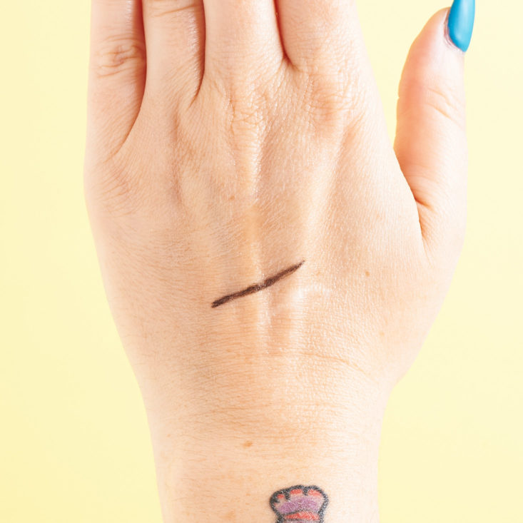 PHB Ethical Beauty Eyeliner in black swatch in Marne's hand