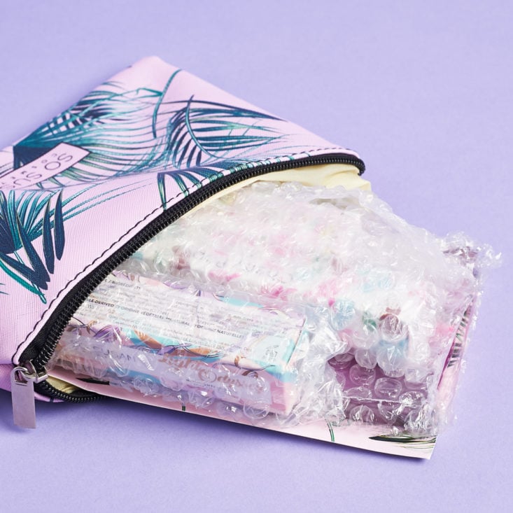 palm makeup bag with bubble wrapped items inside