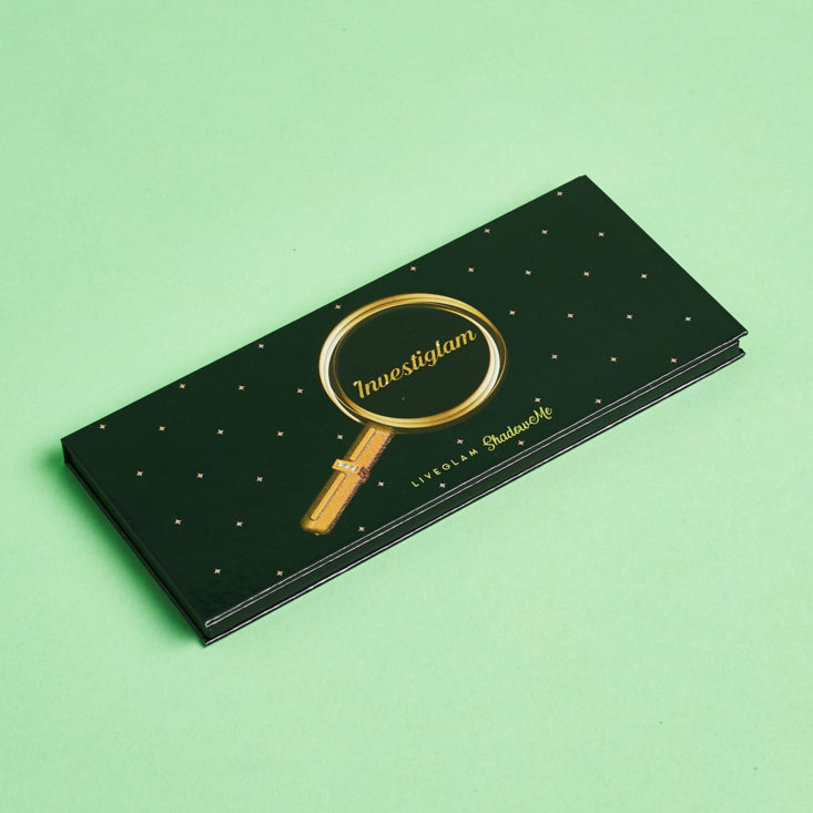 lid of palette with gold magnifying glass